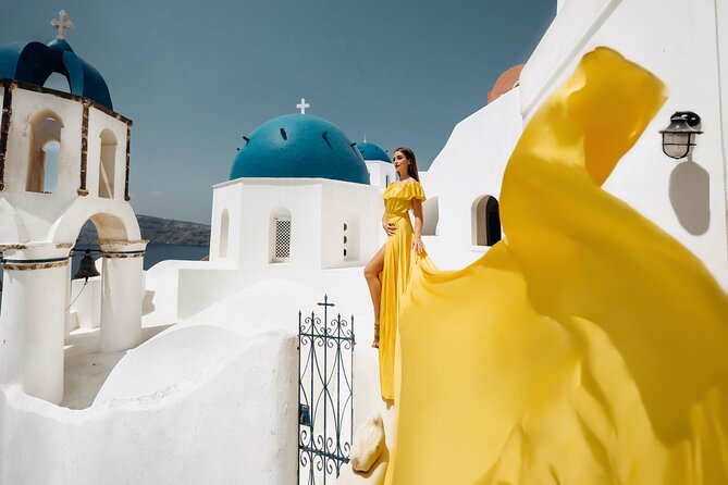 1-Hour Private Santorini Flying Dress Photoshoot - Oia’s old castle and blue-domed church views