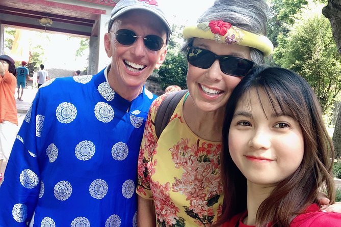 Ao dai Vietnam photograph tour with private car - Phung Hung Mural Street brings color and local stories