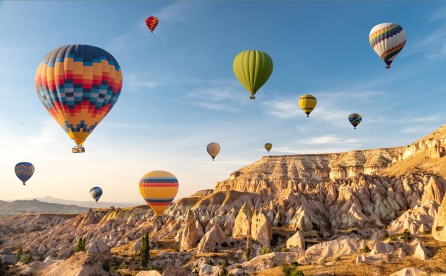 Cappadocia: Sunrise Balloon Watching Tour with Photographer - Love Valley when the sun reaches the balloons