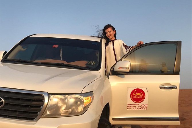 Dubai Half day Desert Safari Quad Bike & Flying Dress Photoshoot - Sandboarding, camel riding, and quad biking