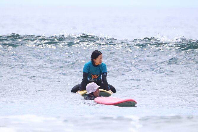 Group Surf Class in Playa de Las Américas with Photographs - Warm-up, water practice, and the first wave