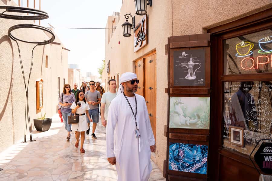 Old Dubai Guided Tour With Photographer: Souks & Street Food - Crossing Dubai Creek by traditional abra