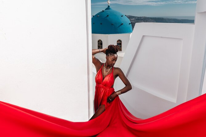 Premium Flying Dress Experience with Hotel Pick up & drop off - Posing near the Blue Dome in Imerovigli