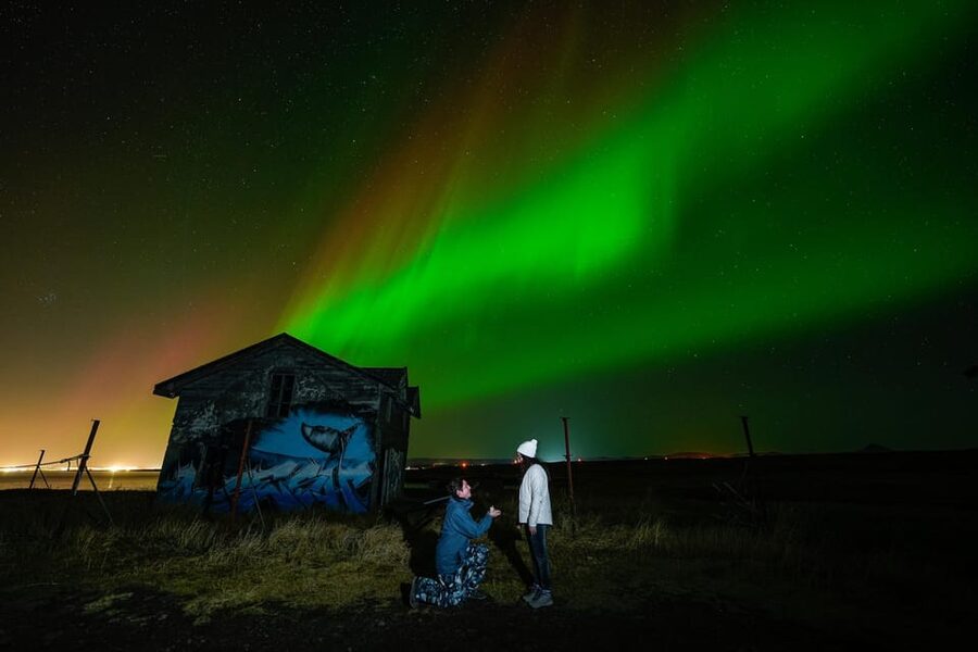 Reykjavik: Northern Lights Tour with Private Photographer - Waiting outside with a chair and a warm suit
