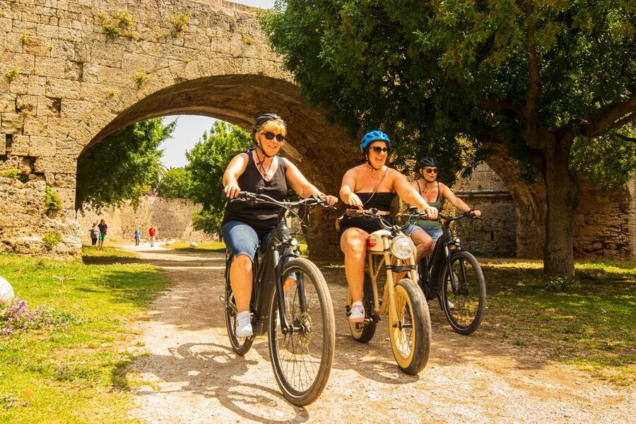 Rhodes: E-bike Highlights Sunset or Morning Photo Tour - Entering Old Town through gates and lanes