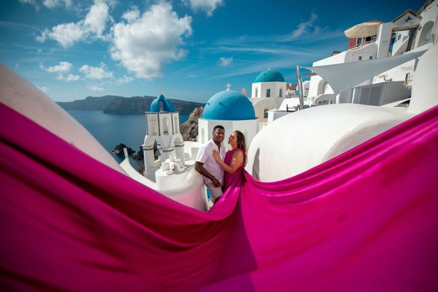 Santorini: Unique Flying Dress Photoshoot Experience - Oia’s blue domes become your photo studio